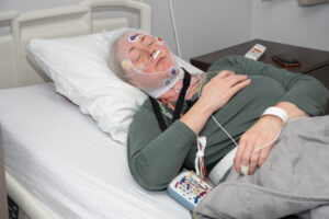 Woman at best sleep doctors in CT having sleep study done.